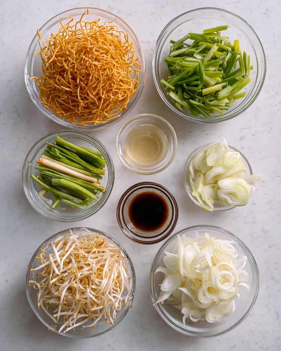 The image shows seven small clear glass bowls arranged in two rows on a white marbled surface. In the top row from left to right, there is a bowl filled with bright orange crispy fried noodles, next to it a bowl with green onion pieces cut into short strips, then a smaller bowl with green and white onion stalks, and finally a bowl with a small amount of light-colored liquid. In the bottom row from left to right, there is a bowl with bean sprouts on top of a white creamy base, a bowl with thinly sliced white onions, and a very small bowl with a dark brown liquid. The bowls and their contents show a variety of textures and pale to bright colors, all presented neatly. photo taken with an iphone --ar 4:5 --v 7