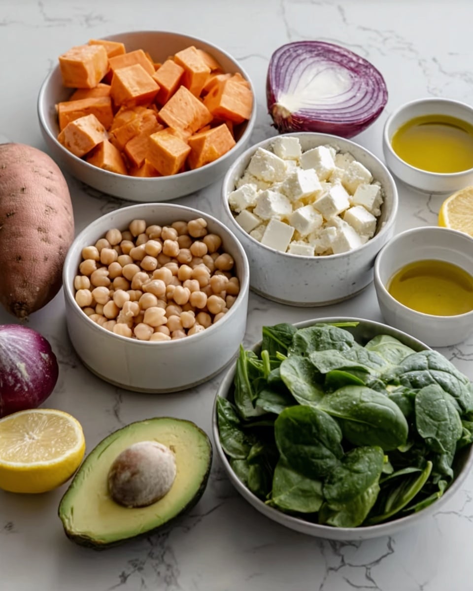The image shows several small white bowls arranged on a white marbled surface, each filled with different ingredients. From left to right, front to back: a white bowl of cubed sweet potatoes (orange color, chunky texture), a white bowl of chickpeas (light beige, round smooth texture), a white bowl of cubed white cheese with soft, crumbly texture, and a white bowl filled with fresh green spinach leaves with smooth, shiny texture. Around the bowls are a halved lemon with bright yellow and juicy flesh, half an avocado with light green flesh and a brown seed in the center, a small white bowl of golden olive oil with a smooth surface, and half of a red onion showing purple and white layers. A whole sweet potato is also present to the left. The image is well-lit and clear, photo taken with an iphone --ar 4:5 --v 7