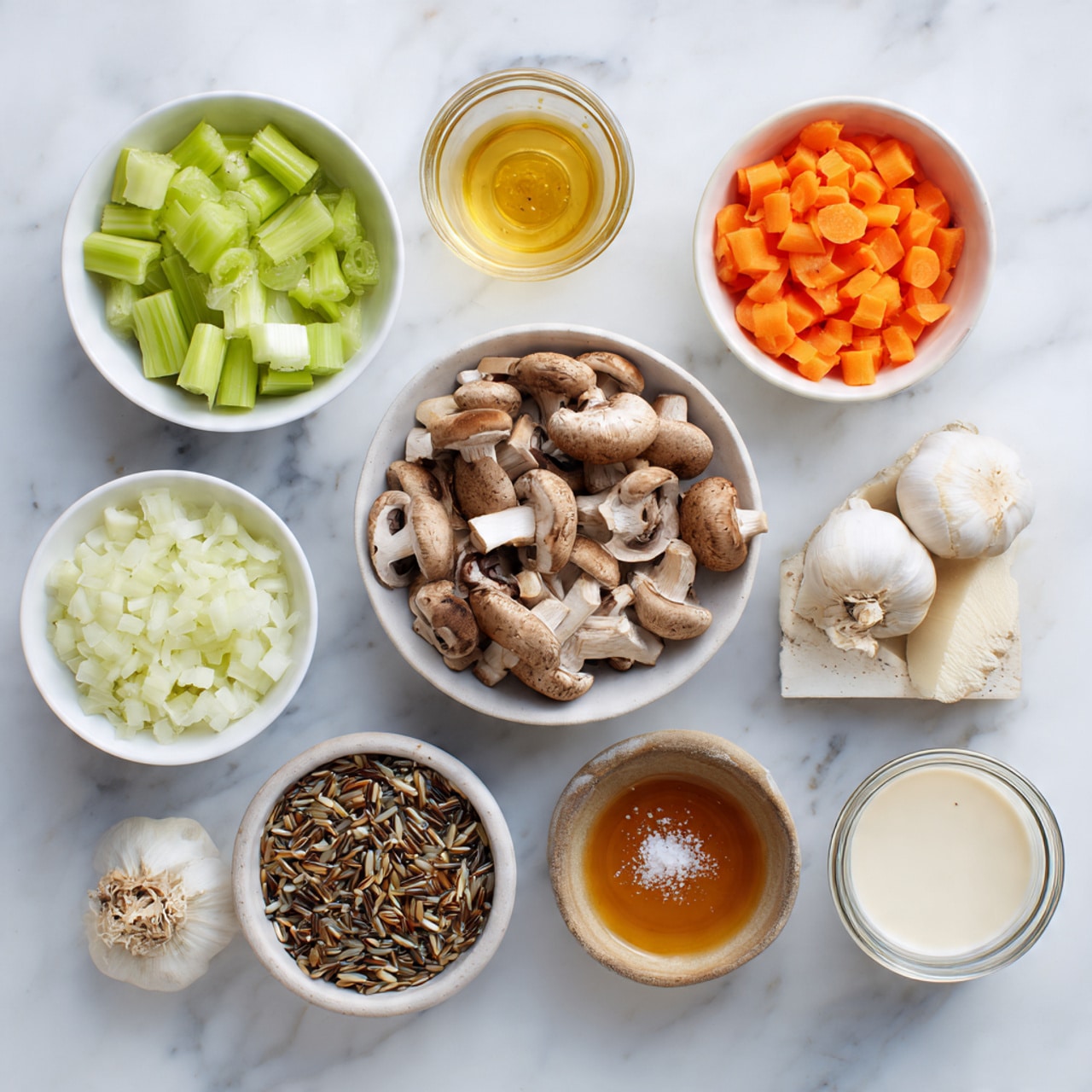 The image shows nine small white bowls and jars arranged on a white marbled surface, each filled with different ingredients. At the center is a bowl filled with sliced brown mushrooms, with their soft, beige inside visible. Surrounding it clockwise are a bowl of small, chopped light green celery pieces, a block of orange-yellow cheese with white salt flakes on top, a bowl of chopped bright orange carrots, a bowl filled with finely diced white onions, a jar containing a clear amber liquid, a small bowl with a mix of wild rice grains in brown, white, and black colors, a jar with white creamy liquid, and lastly a bowl holding three whole peeled garlic cloves and a light brown powdery spice. The setup is neat and organized, showing fresh ingredients in simple containers. Photo taken with an iphone --ar 4:5 --v 7