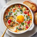 Baked Feta Eggs with Spinach and Tomatoes Recipe