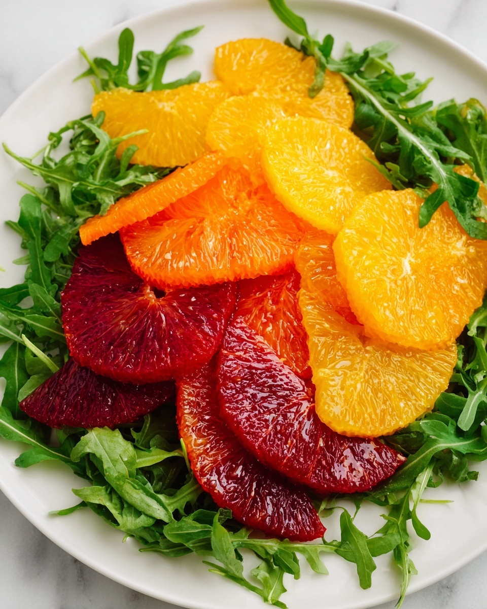 A white bowl filled with layers of fresh green arugula at the base, topped with bright orange and yellow citrus slices neatly placed in the center. Above the citrus, finely chopped green herbs cover part of the fruit. In the background, deep red sun-dried tomatoes add a rich color contrast. A light yellow dressing is being poured over the top center of the salad. The bowl is set against a white marbled surface. Photo taken with an iphone --ar 4:5 --v 7