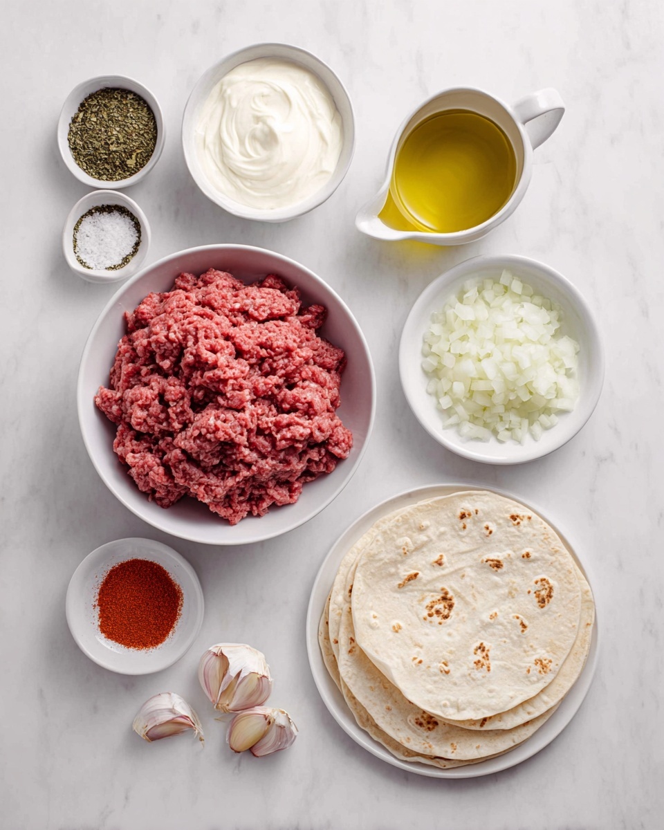 The image shows a white marbled surface with several small white bowls arranged neatly. In the center, there is a bowl filled with raw ground beef, which is a rich pink-red color and has a soft, crumbly texture. Above it, a bowl holds a smooth white creamy ingredient, and to the left, two small bowls contain greenish dried herbs and fine white salt. Below the meat, a small bowl of bright red paprika powder sits next to three garlic cloves with pale purple skin. To the right of the meat, there is a bowl filled with finely chopped white onions and a small white pitcher holding golden olive oil. On the far right, two round white flatbreads with light brown spots are stacked on a white plate. The whole setup appears clean and organized on the white marbled surface. photo taken with an iphone --ar 4:5 --v 7