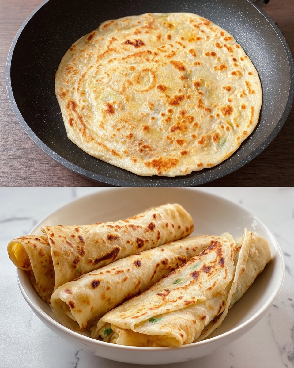 A single round flatbread is shown cooking in a black non-stick pan. The flatbread is light beige in color with small green herb pieces scattered evenly throughout its surface and has golden brown spots lightly toasted at various places. The dough's texture looks soft and slightly puffy in some areas. The pan has a slightly rough texture visible near the edges. The scene is lively but simple with focus on the cooking flatbread. Photo taken with an iphone --ar 4:5 --v 7