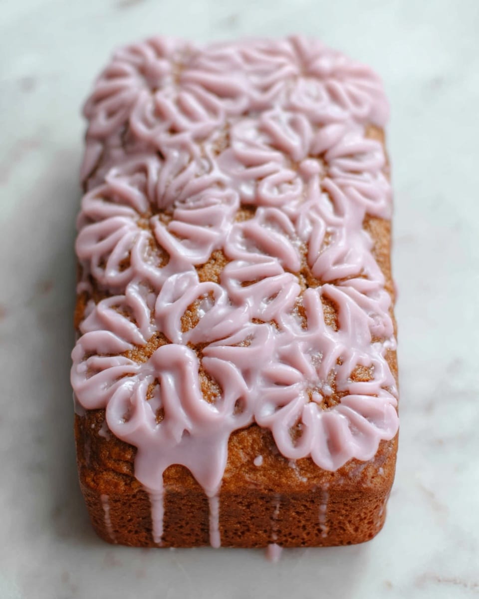 A single thick, rectangular brown waffle with a rough, crispy texture on its surface sits on a white marbled surface. A woman's hand is holding a small clear glass cup tilted above the waffle, pouring smooth, light pink sauce in a flowing stream that spreads unevenly over the waffle's top. In the blurred background, there is a small glass container and some soft, out-of-focus plants. The scene looks bright and clean, with soft natural lighting. photo taken with an iphone --ar 4:5 --v 7