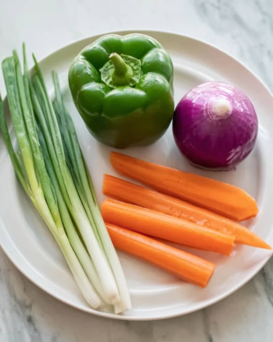 A white plate holds five vegetables neatly placed on a white marbled surface. There is one whole green bell pepper positioned near the top center of the plate. To the right of the bell pepper sits a round half-cut purple onion, showing its smooth outer skin. Below these, three orange carrots lay side by side, their bright color contrasting with the green and purple above. On the left side, three long green spring onions with white bulbs rest diagonally, their thin green stalks extending beyond the edge of the plate. The light is soft and natural. Photo taken with an iphone --ar 4:5 --v 7