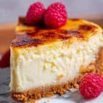 Crème Brûlée Cheesecake with Gingersnap Crust and Raspberry Garnish Recipe