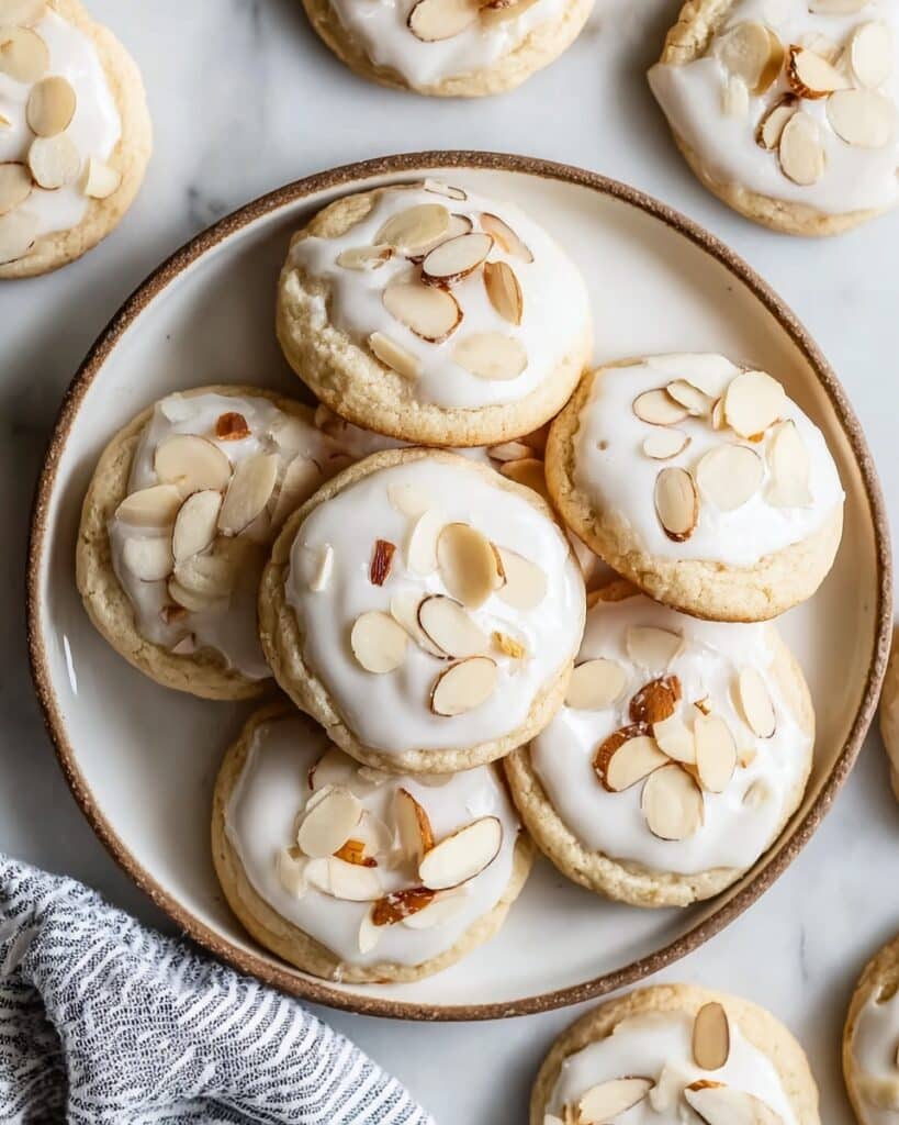Almond Sugar Cookies with Almond Icing and Sliced Almond Garnish Recipe