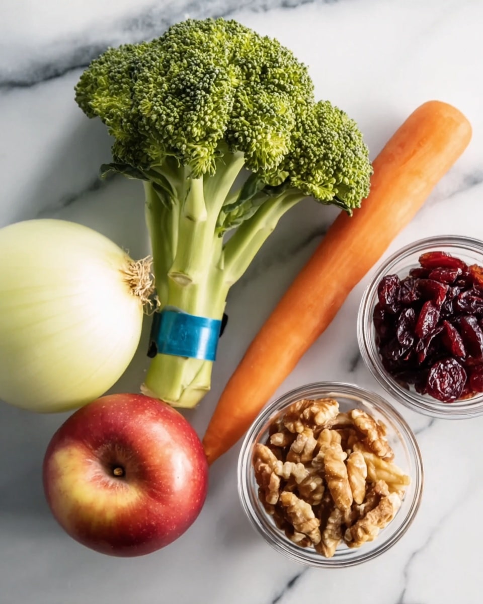 The image shows fresh ingredients placed on a white marbled surface. On the left, there is a bunch of bright green broccoli with a blue band around the stems. Next to it, there is a halved onion showing its light yellow inside. To the right, a shiny, red apple sits beside a long, smooth orange carrot. On the far right, two small clear glass bowls hold dark red dried cranberries and light brown walnuts. The colors contrast well, showing fresh and natural textures photo taken with an iphone --ar 4:5 --v 7