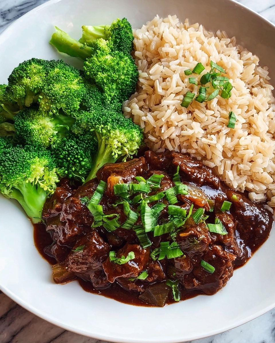 A white bowl filled with rich, dark brown stew with many pieces of tender meat. The meat pieces have a shiny, saucy texture, and there are green chili peppers mixed in, adding a splash of bright green color. The stew looks thick and glossy with visible bits of vegetables and herbs. The bowl sits on a white marbled surface. photo taken with an iphone --ar 4:5 --v 7