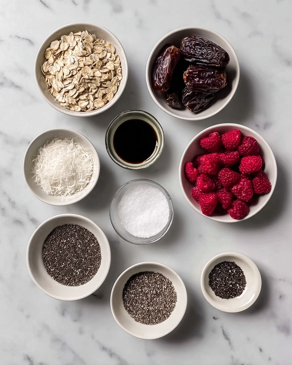 The image shows eight small white bowls arranged on a white marbled surface, each holding a different ingredient. Starting from the top left and moving clockwise, the first bowl contains beige rolled oats with a rough texture. Next is a bowl filled with dark brown Medjool dates that have a wrinkled, glossy surface. Then, a tiny bowl holds a dark liquid vanilla extract, smooth and shiny. Nearby, a small bowl has fine acai powder in a deep black-purple shade. Below, a bowl is filled with bright red frozen raspberries covered lightly with frost. In the center bottom, there is a tiny bowl of fine white salt. To its left, a larger bowl holds white, powdery shredded coconut. Lastly, another small bowl contains tiny black chia seeds with a matte finish. Each bowl's contents are clearly visible and well separated. photo taken with an iphone --ar 4:5 --v 7