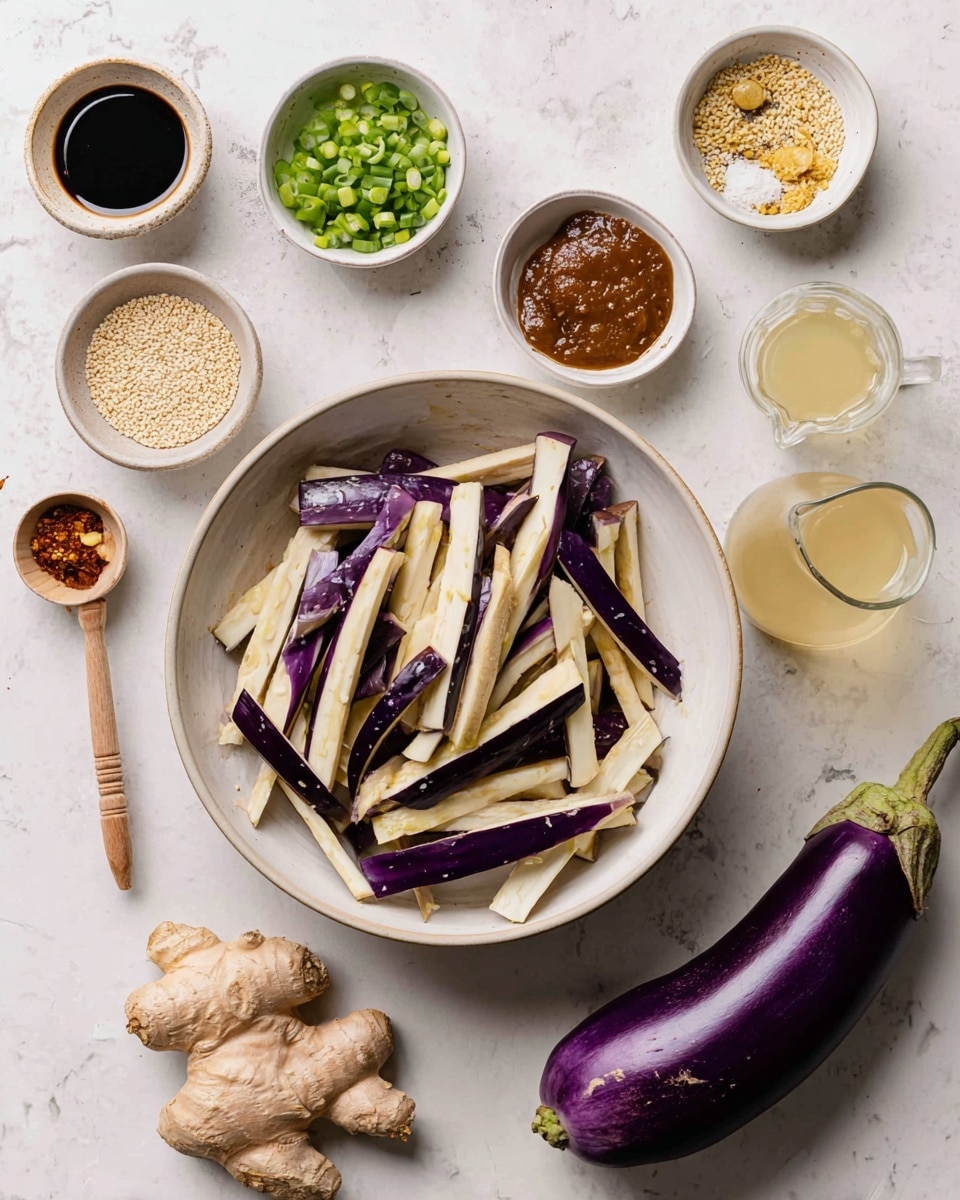 In the image, a large white bowl filled with long, white and purple strips of eggplant is in the center. Around the bowl are small white bowls containing various ingredients: chopped green onions, chopped garlic, chopped ginger, sesame seeds, a dark soy sauce, a thick brown paste, honey with a wooden dipper, a pale liquid in a small pitcher, and a small clear glass of water. A whole long purple eggplant, a garlic bulb, and two pieces of fresh ginger root are placed on the white marbled surface around the bowls. The arrangement is neat and the colors are natural and fresh. Photo taken with an iphone --ar 4:5 --v 7