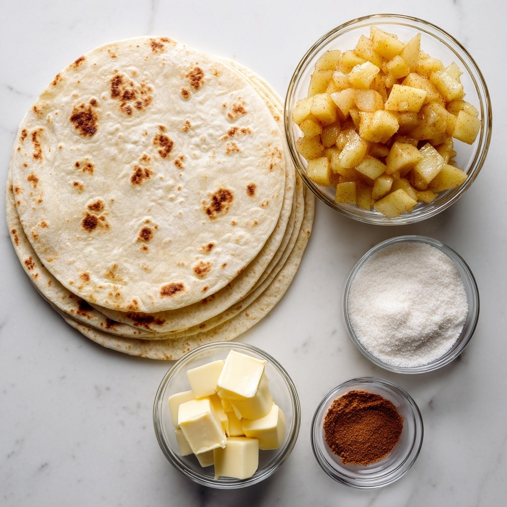 A white marbled surface holds five main ingredients arranged neatly: a stack of light beige flour tortillas with small brown spots on the left, a clear glass bowl filled with chunky golden-yellow apple pie filling in the center, a small clear bowl of pale yellow butter cubes below the tortillas, another small clear bowl with white granulated sugar to the right of the butter, and a tiny clear bowl of reddish-brown cinnamon powder to the right of the sugar. Each item is labeled in bold black text above or beside it. Photo taken with an iphone --ar 4:5 --v 7