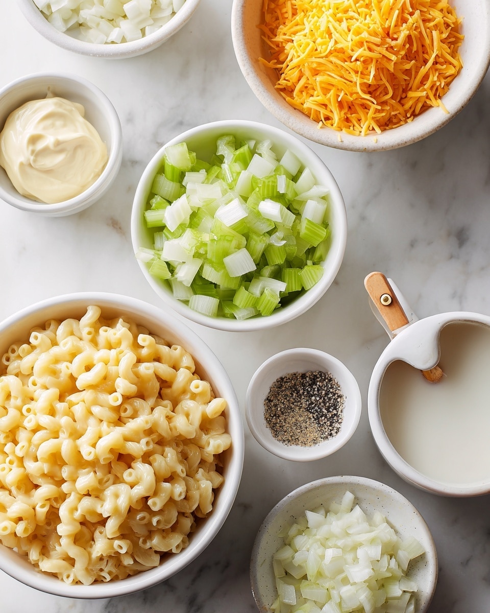 There is a close-up view of several white bowls and a white measuring cup arranged on a white marbled surface. The largest bowl at the bottom is filled with cooked elbow macaroni, showing a smooth, pale yellow texture. To its top right, a bowl contains bright orange shredded cheddar cheese with a soft texture. Directly above the macaroni, another bowl is filled with chopped light green celery pieces, crisp in appearance. Next to the celery is a bowl with finely chopped white onions that look moist and soft. Near the top right corner is a small bowl holding a mixture of black pepper and white salt, while on the left side, another bowl contains creamy, pale yellow mayonnaise. A small white measuring cup with a wooden handle is placed on the right side, holding white milk. The overall arrangement is neat and colorful on the white marbled background, photo taken with an iphone --ar 4:5 --v 7