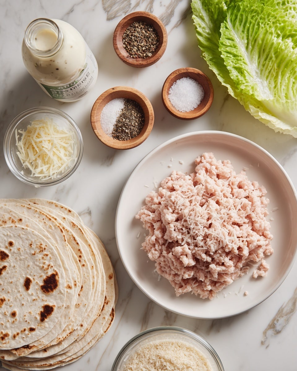 A white plate holds light pink ground chicken with a soft, slightly wavy texture placed on the right, surrounded by small glass and wooden bowls containing fine white salt, black pepper, Italian seasoning in a clear jar, and grated pale yellow parmesan cheese; below the plate, a stack of soft, white tortillas with light brown spots rests next to a clear container of crisp, green romaine lettuce leaves, a small clear bowl of light beige bread crumbs, and a tall white bottle of creamy Caesar dressing with a green label, all arranged neatly on a white marbled surface photo taken with an iphone --ar 4:5 --v 7