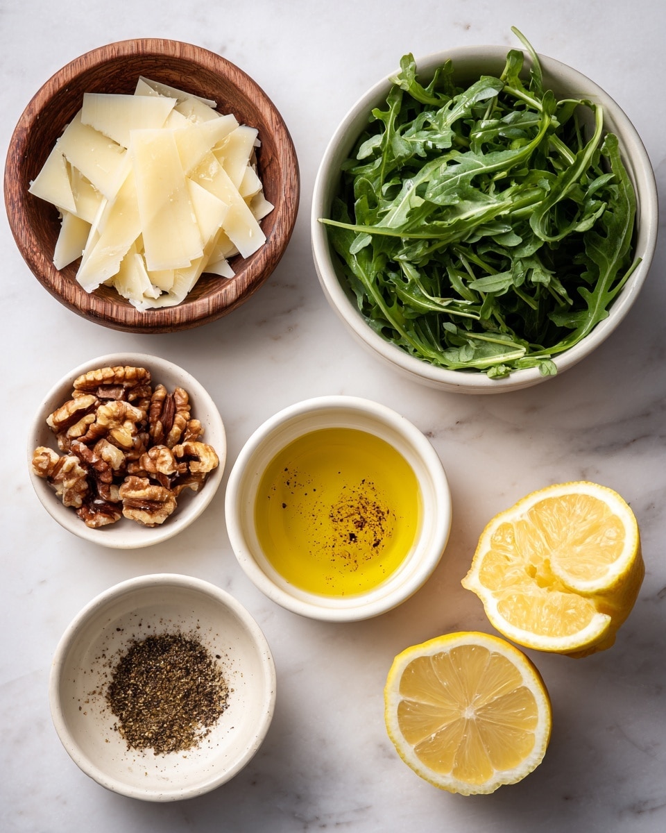 The image shows five ingredients arranged on a white marbled surface. At the top left, a wooden bowl holds thin, off-white shavings of cheese. To the right, a white bowl is filled with dark green arugula leaves. Below the cheese, a small white bowl contains brown, broken walnut pieces. In the center, another white bowl holds golden olive oil with some ground black pepper sprinkled on top. On the right side, there are two yellow lemon halves with visible pulp and juice inside. Photo taken with an iphone --ar 4:5 --v 7