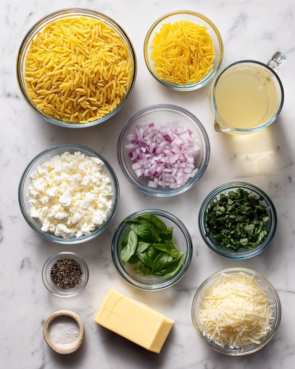 The image shows various ingredients placed separately on a white marbled surface. There are clear glass bowls holding different items: a large bowl of yellow orzo pasta grains on the top left, a smaller bowl of bright yellow lemon zest above center, a clear pitcher with light golden chicken broth in the middle, a bowl of white heavy cream on the top right, a bowl of finely chopped shallots with light purple and white pieces on the right side, a bowl of chopped dark green basil below that, a bowl of white grated Parmesan cheese on the bottom right, and a small bowl of finely minced yellow garlic near the bottom center. Below the orzo is a stick of pale yellow butter, next to a tiny dish with black and white salt and pepper mix on the bottom left. A small bowl of light yellow lemon juice sits to the right of the salt and pepper. Each item is neatly arranged and labeled clearly. Photo taken with an iphone --ar 4:5 --v 7